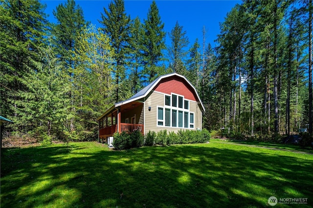 view of outdoor structure featuring a forest view