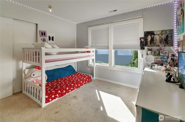 bedroom featuring visible vents and carpet flooring