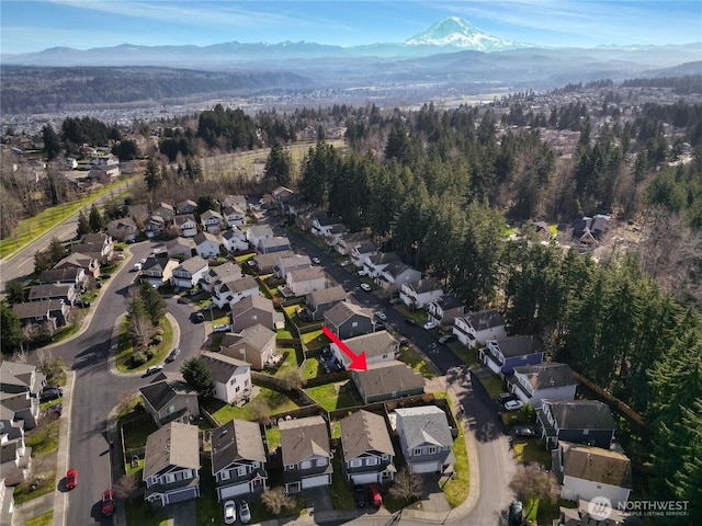 bird's eye view with a residential view and a mountain view