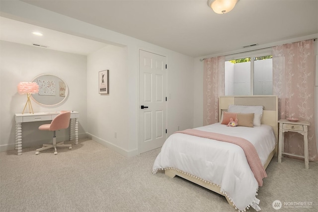 carpeted bedroom featuring visible vents and baseboards