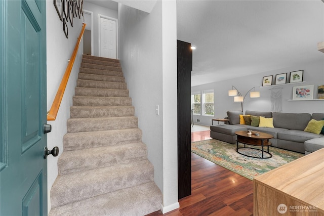 stairs with wood finished floors