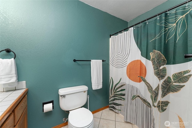 full bath with vanity, a shower with shower curtain, baseboards, tile patterned floors, and toilet