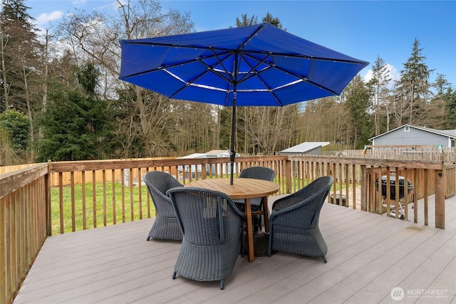 deck with outdoor dining space