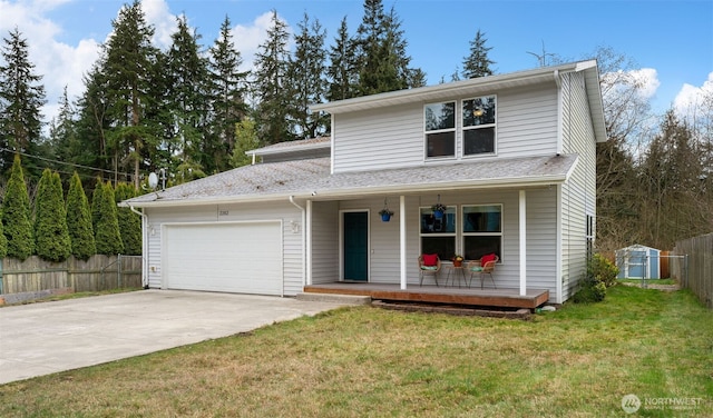 traditional-style home featuring fence, covered porch, a garage, and driveway