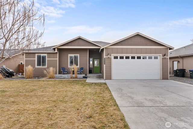 ranch-style house with a garage, driveway, and a front yard