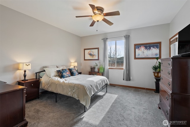 carpeted bedroom featuring baseboards and a ceiling fan