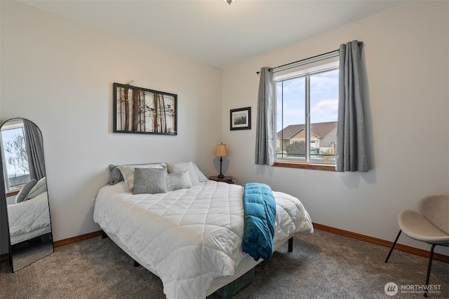 bedroom featuring baseboards and carpet flooring