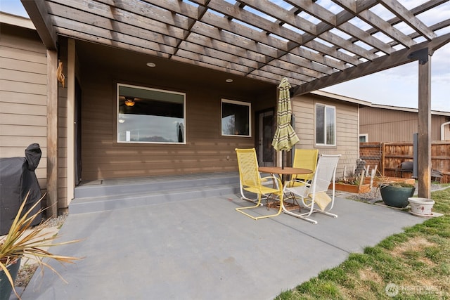 view of patio featuring a pergola, outdoor dining area, and fence