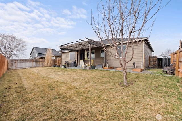 rear view of property with a patio area, a pergola, a fenced backyard, and a lawn