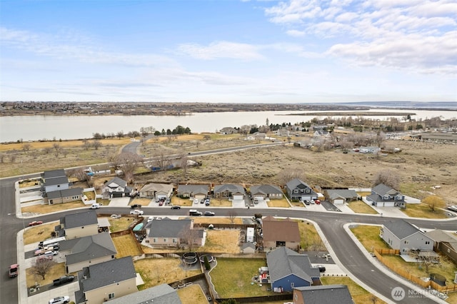 aerial view featuring a residential view and a water view