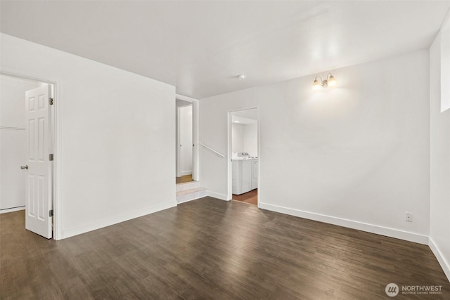 empty room with baseboards and dark wood-style flooring