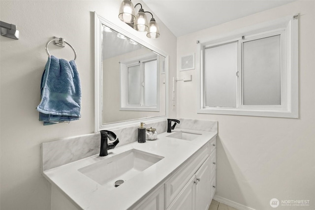 bathroom with a sink and double vanity