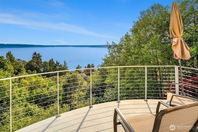 balcony featuring a water view