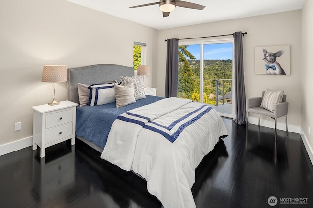 bedroom featuring ceiling fan, baseboards, and wood finished floors