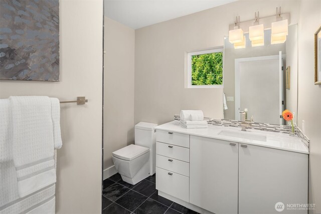 bathroom with tile patterned floors, toilet, and vanity