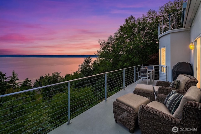 balcony featuring a water view