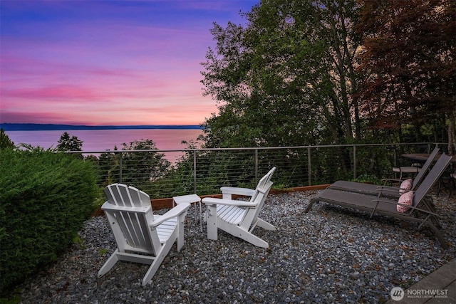 patio terrace at dusk with a water view