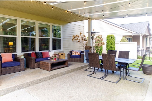 view of patio / terrace featuring an outdoor hangout area, outdoor dining space, and fence