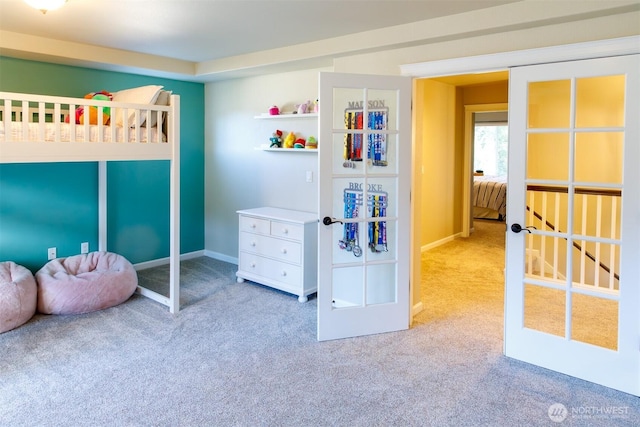 carpeted bedroom with baseboards