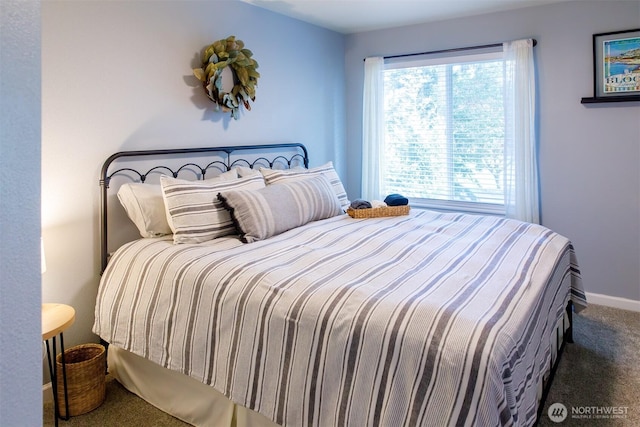 bedroom featuring baseboards and carpet floors