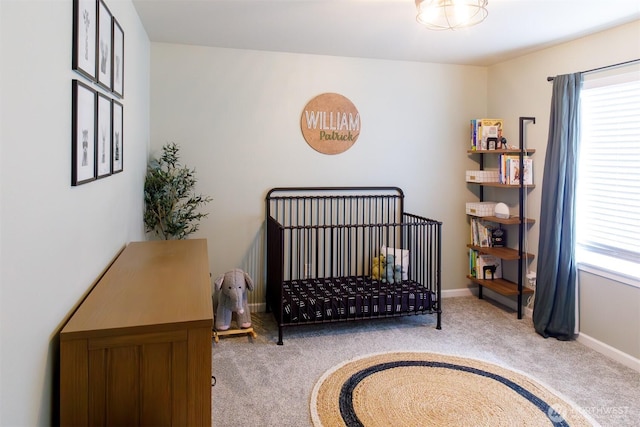 carpeted bedroom with baseboards