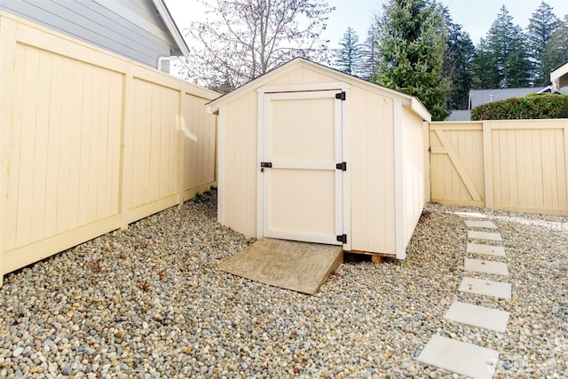 view of shed with a fenced backyard