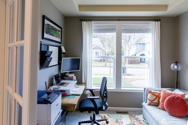 office space featuring visible vents and baseboards