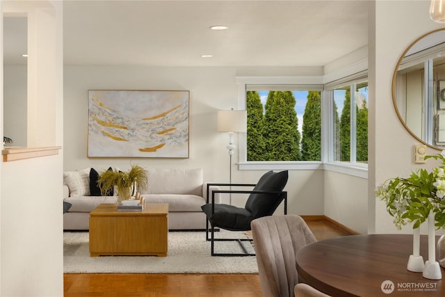 living room with recessed lighting and baseboards