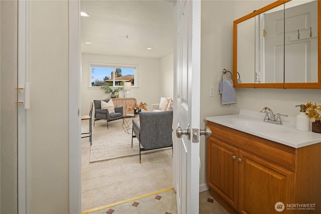 bathroom with recessed lighting and vanity