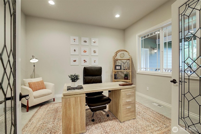 office space with recessed lighting, visible vents, and baseboards