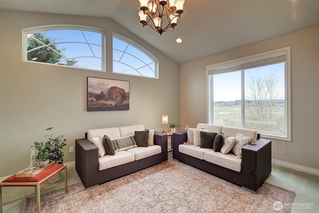 living area with an inviting chandelier, plenty of natural light, carpet floors, and vaulted ceiling