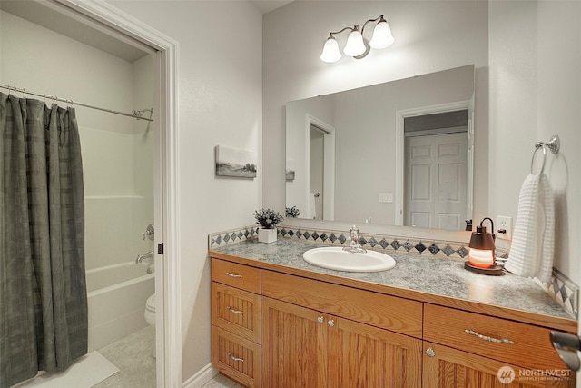 bathroom featuring shower / tub combo with curtain, vanity, and toilet