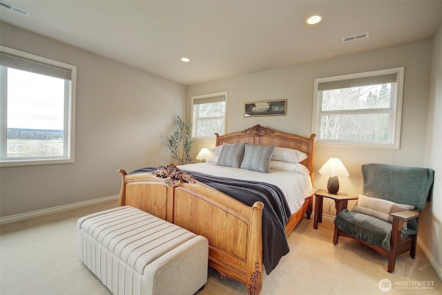 bedroom featuring recessed lighting, visible vents, light colored carpet, and baseboards