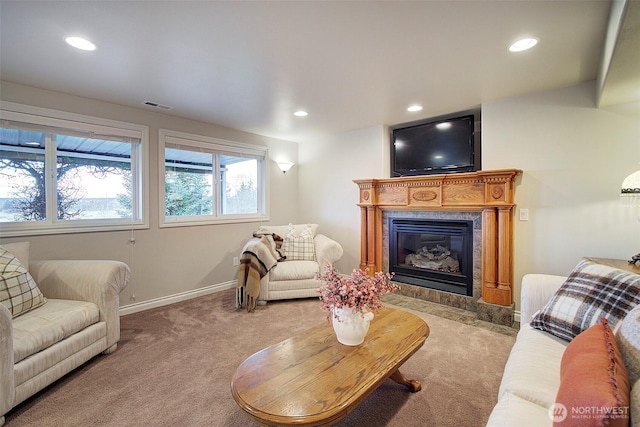 living area featuring recessed lighting, visible vents, baseboards, and carpet