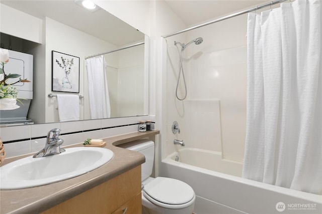 bathroom with vanity, toilet, tasteful backsplash, and shower / tub combo with curtain