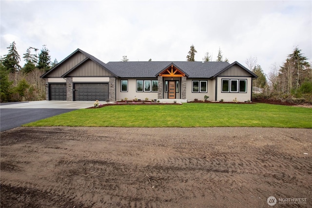 view of front of house with driveway, a shingled roof, board and batten siding, a front yard, and an attached garage