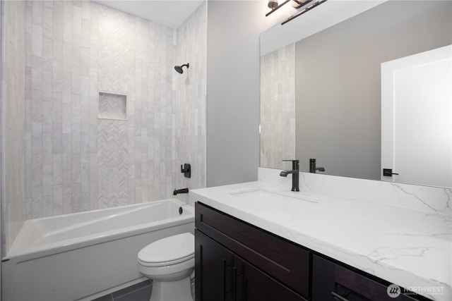 bathroom with vanity, toilet, and shower / tub combination