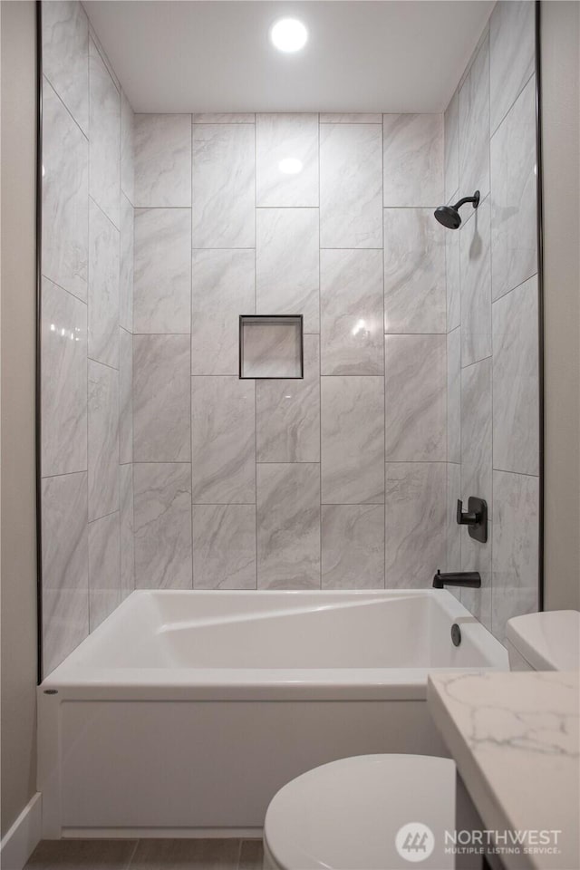 bathroom with toilet and shower / bathtub combination