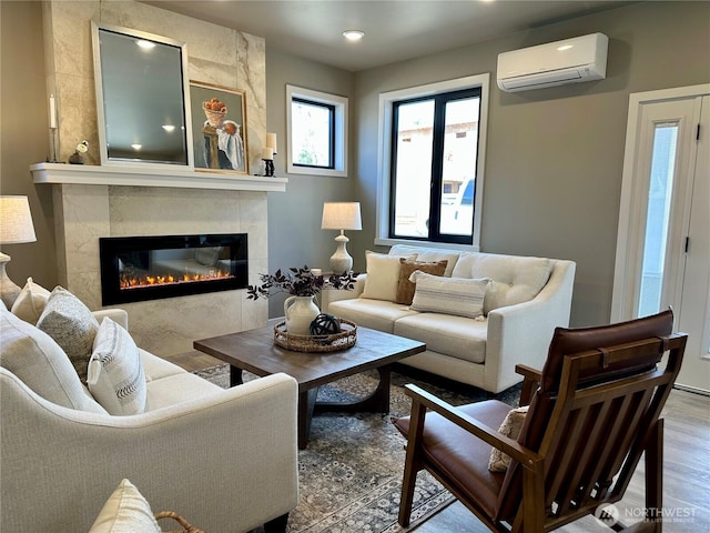 570 Creston Ct, Bellingham, WA 98226 - living area featuring a wall mounted air conditioner, a high end fireplace, wood finished floors, and recessed lighting