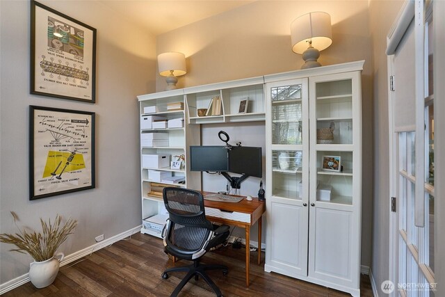 office featuring dark wood-type flooring and baseboards