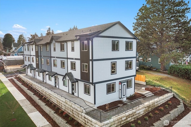 view of side of property with a residential view