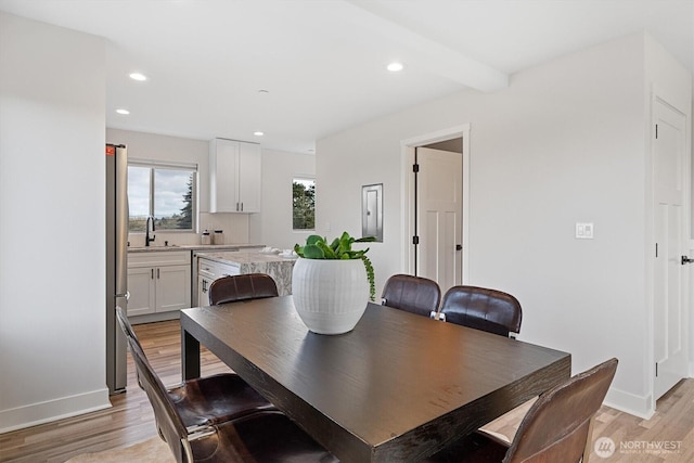 dining room featuring recessed lighting, light wood-type flooring, and baseboards