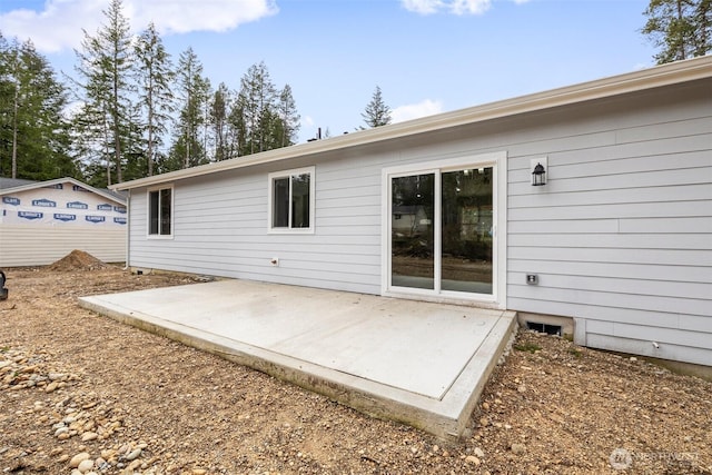 back of property featuring a patio