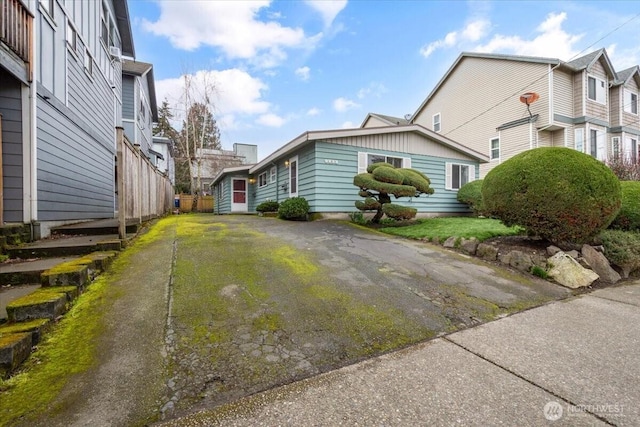 view of home's exterior with aphalt driveway