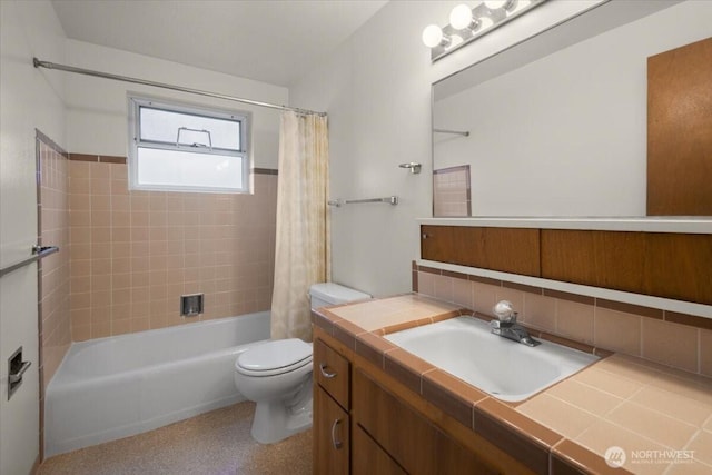 bathroom with vanity, toilet, shower / bathtub combination with curtain, and backsplash