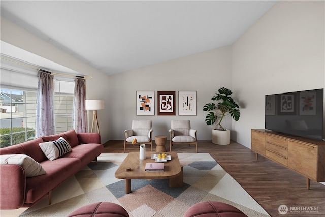 living area with lofted ceiling and wood finished floors