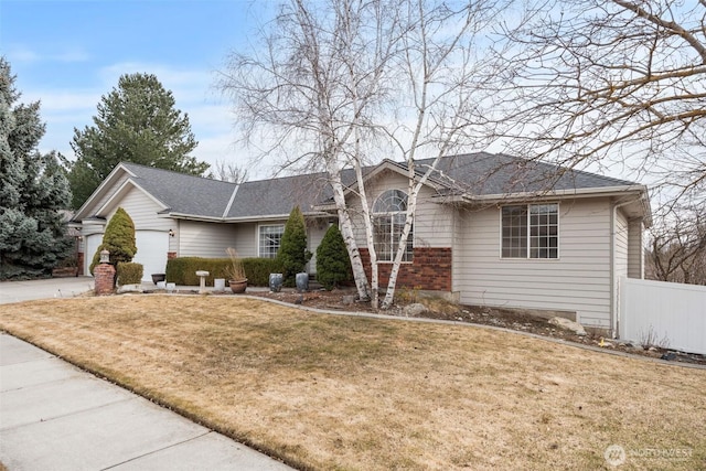 ranch-style home featuring a garage, driveway, a front lawn, and fence