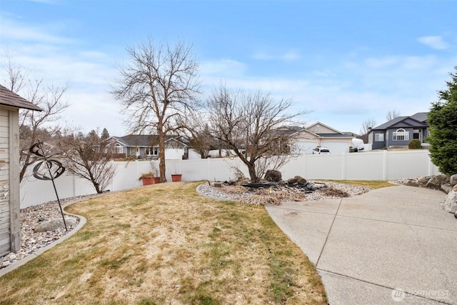 view of yard featuring a patio area and a fenced backyard