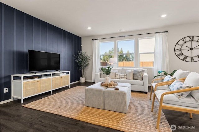 living room with dark wood-type flooring, recessed lighting, baseboards, and visible vents