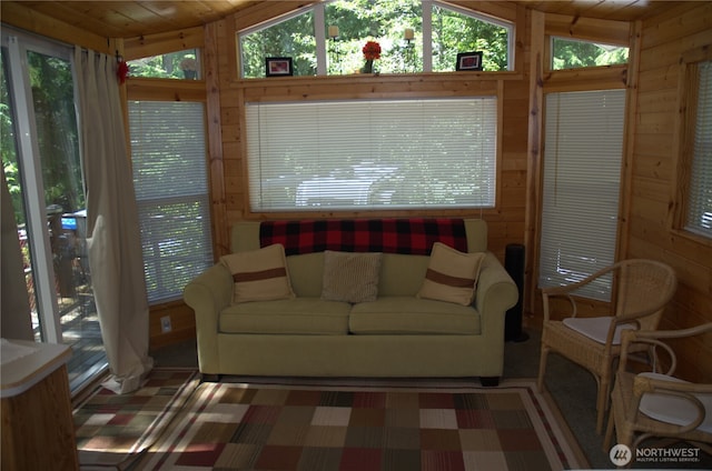 sunroom featuring wood ceiling and vaulted ceiling